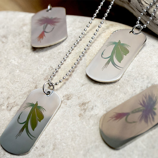 Metal human dog tags with fishing fly designs on a stainless steel pendant