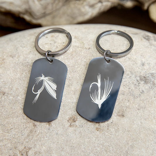 Stainless steel dog tags keychains with engraved fly fishing designs.