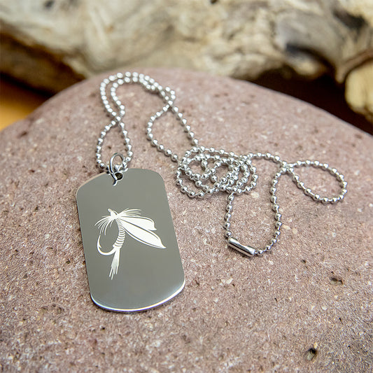 Stainless steel dog tag with engraved fly fishing designs.